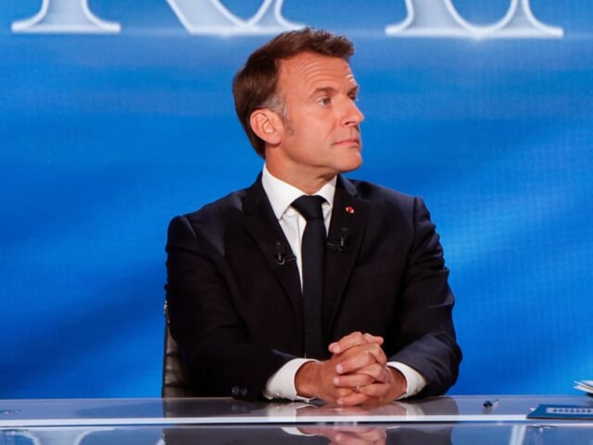 France's President Emmanuel Macron looks on on the set during his guest appearance on a sp