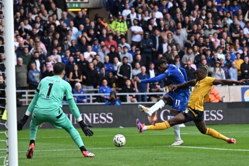 Chelsea's Noni Madueke (2R) shoots to score against Wolves