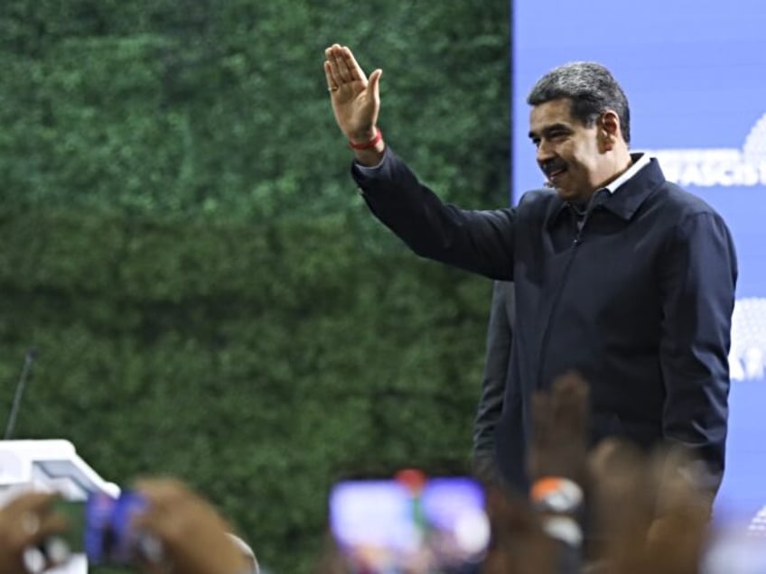 CARACAS, VENEZUELA - NOVEMBER 5: Venezuelan President Nicolas Maduro greets his supporters