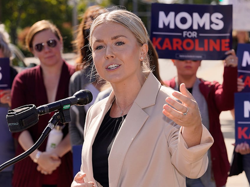 FILE - New Hampshire Republican 1st Congressional District candidate Karoline Leavitt at a campaign event, Sept. 29, 2022, in Manchester, N.H. The House GOP's Class of 2022 midterm candidates includes a distinct group — a new generation of political outsiders, populists and some extremists. They would bring an untested and potentially unruly majority if Republicans win the House in the Nov. 8 election. (AP Photo/Charles Krupa, File)