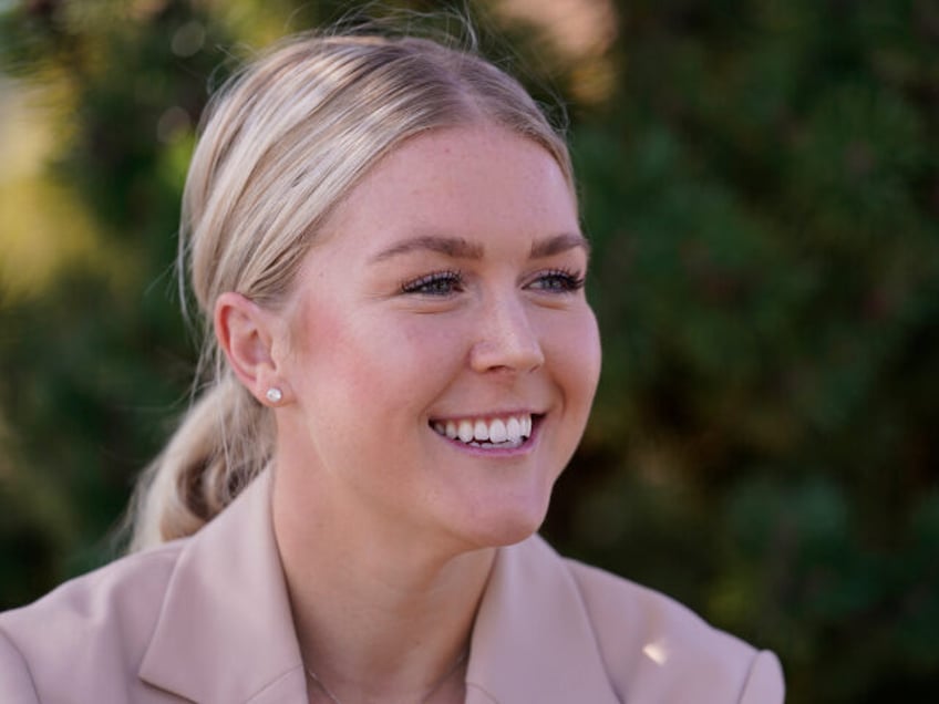 New Hampshire Republican 1st Congressional District candidate Karoline Leavitt smiles during an interview after a campaign event, Thursday, Sept. 29, 2022, in Manchester, N.H. Leavitt is facing incumbent Sen. Chris Pappas in the general election. (AP Photo/Charles Krupa, File)