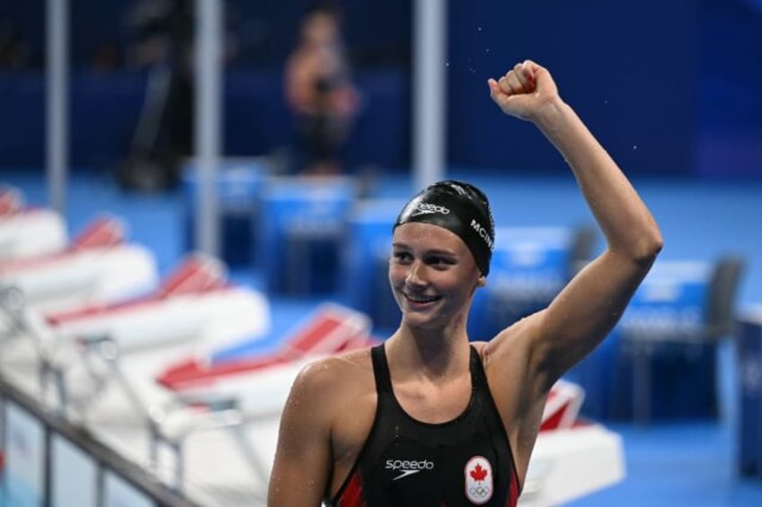 Canada's Summer Mcintosh celebrates after winning the final of the women's 200m individual