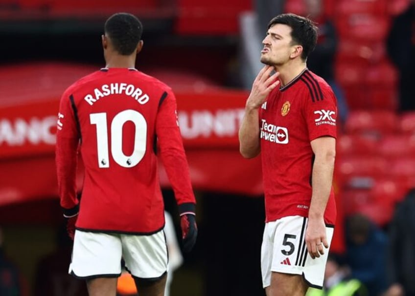 Manchester United's Marcus Rashford (L) and Harry Maguire (R) after their defeat against F