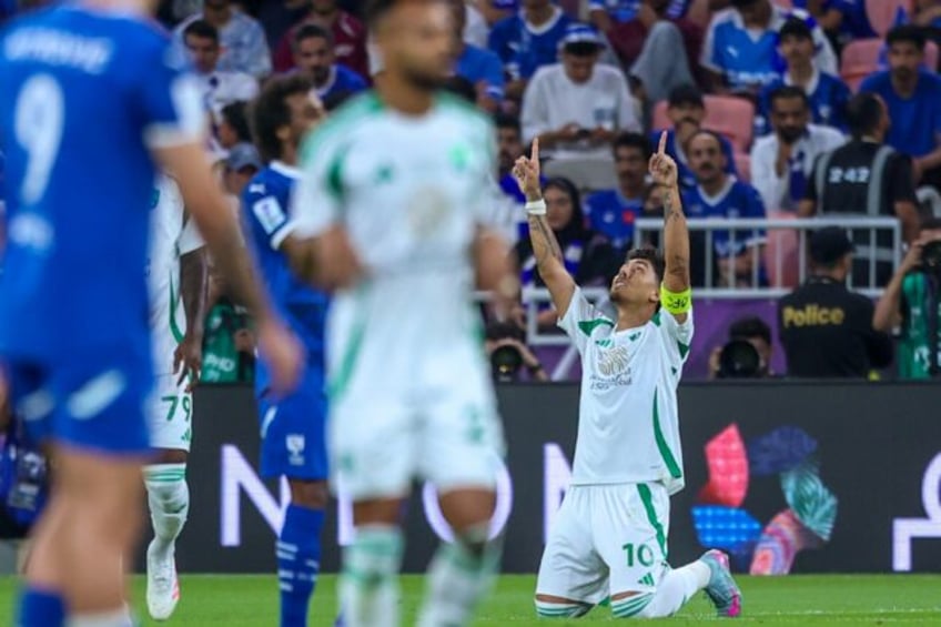 Roberto Firmino points to the sky after scoring Al Ahli's first goal in their Asian Champi