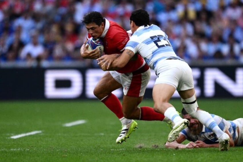 Wales winger Louis Rees-Zammit is tackled during the World Cup quater-final against Argent