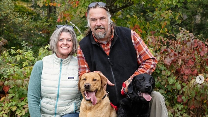 ginna dix and matt dix are pictured with their dog 