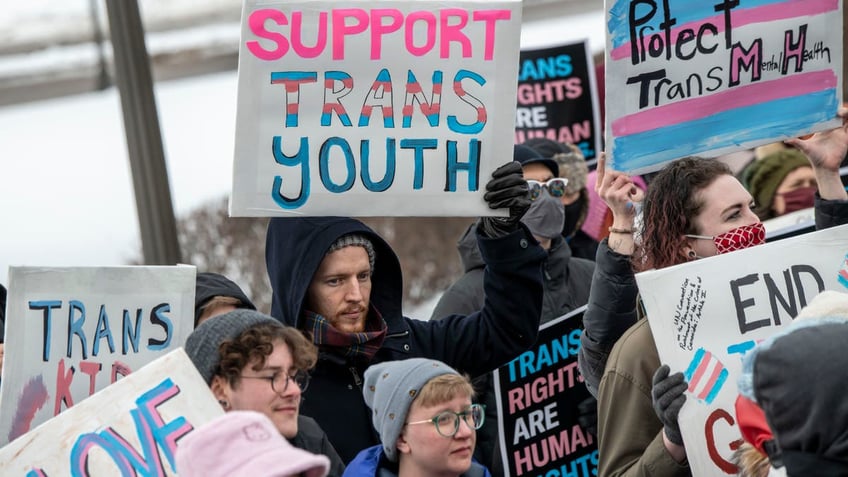 Trans youth activists signs