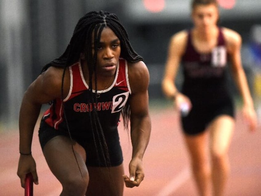 Cromwell's Andraya Yearwood awaits the start of the girls 4x400 relay at last year&#0