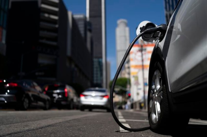 major automakers unite to build electric vehicle charging network they say will rival teslas