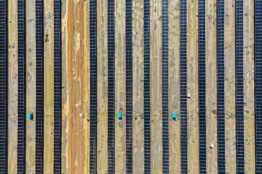 This aerial photograph taken on October 15, 2024 shows solar panels in India's Gujarat sta