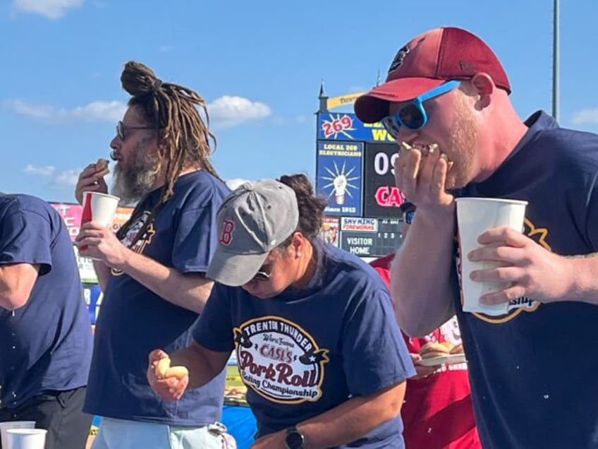 Competitors take part in a pork roll competitive eating contest in Trenton, New Jersy