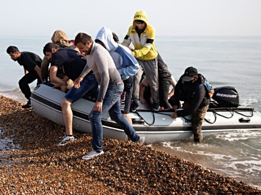 DEAL, ENGLAND - SEPTEMBER 14: Migrants land on Deal beach after crossing the English chann