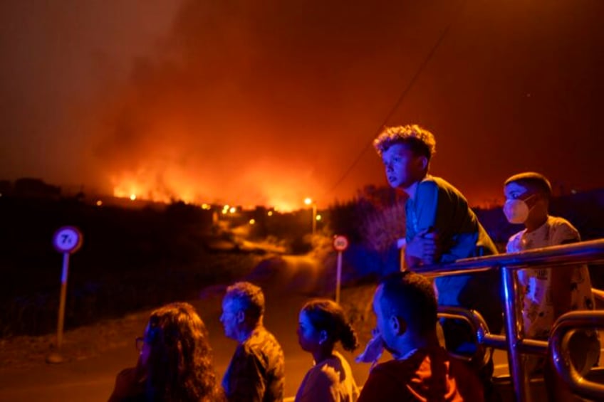 major wildfires burn in greece spains canary island of tenerife