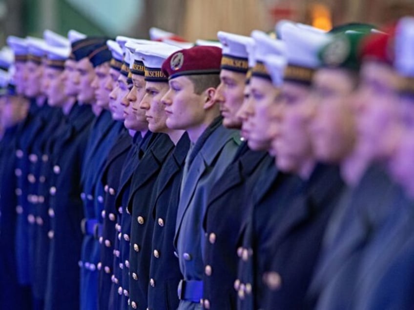 14 December 2023, Mecklenburg-Western Pomerania, Stralsund: Bundeswehr recruits stand in the harbor during the swearing-in ceremony. 145 new soldiers from the Parow Naval Academy have been sworn in. Photo: Stefan Sauer/dpa (Photo by Stefan Sauer/picture alliance via Getty Images)