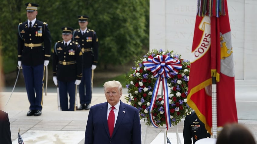 Former President Donald Trump with military wreath at Arlington National Cemetery