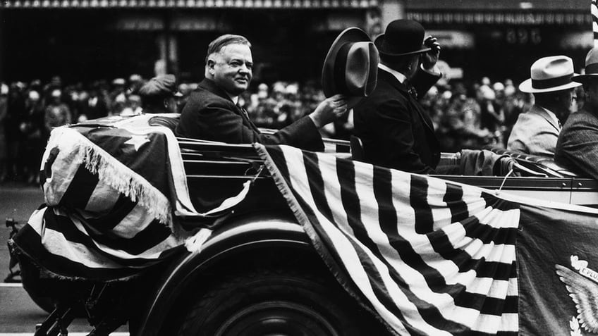 Herbert Hoover waving his hat