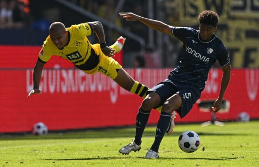 malen rescues point for disappointing dortmund at bochum