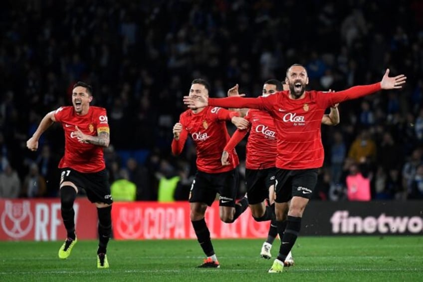 Real Mallorca's players celebrate their ticket to the Copa del Rey final