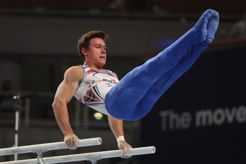 Brody Malone competes on the parallel bars on the way to the men's all-around title at the