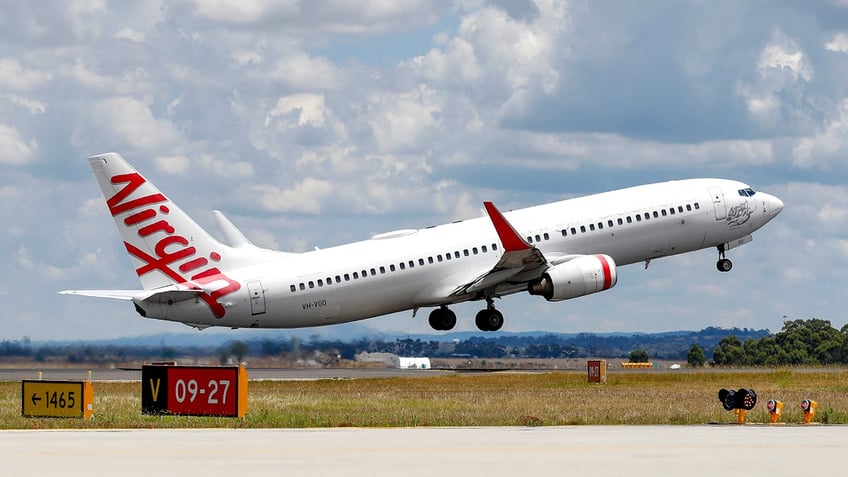 A Virgin Airlines plane takes off from Melbourne Airport in Melbourne, Australia.