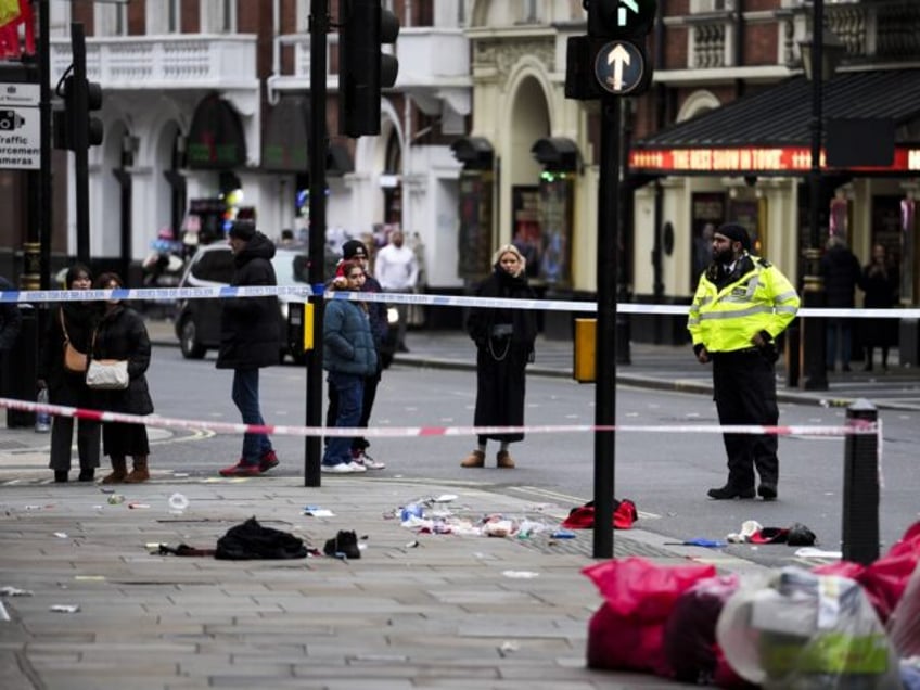 The scene on Shaftesbury Avenue in central London after four people were injured, one seri