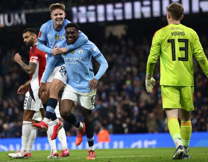 Divin Mubama (centre) scored on his Manchester City debut