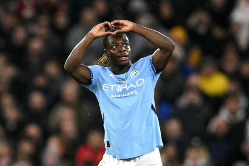 Jeremy Doku celebrates scoring Manchester City's third goal against Nottingham Forest