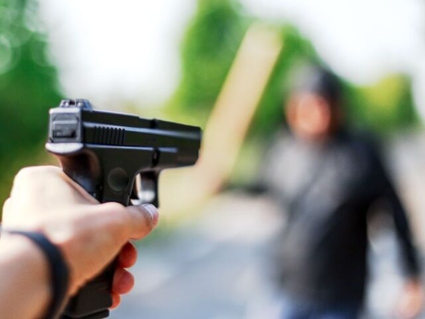 man dies after pulling gun on lawfully armed man during robbery attempt