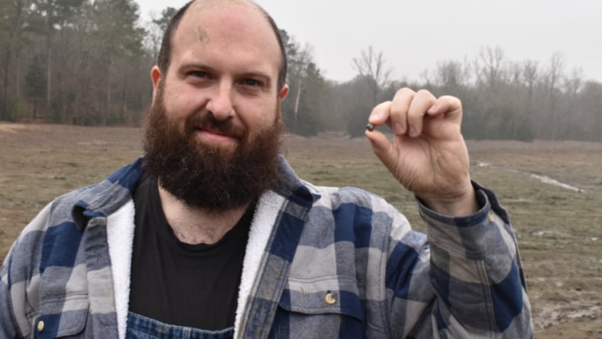 French tourist holding brown diamond