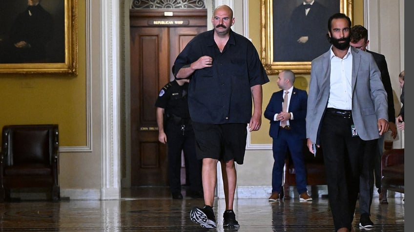 man in john fetterman halloween costume tosses activist confronting senator