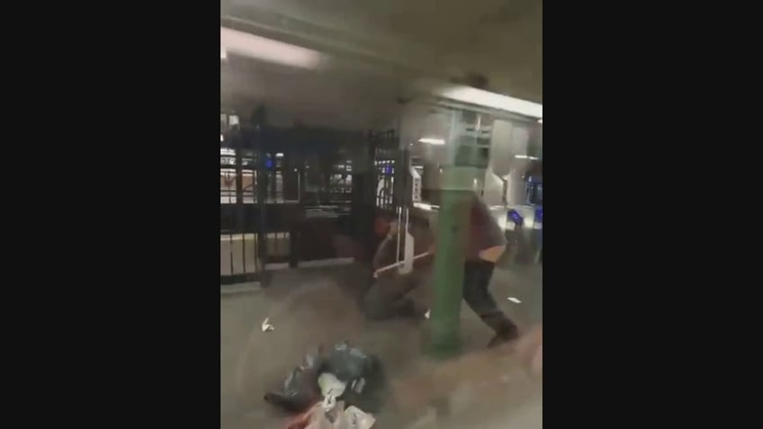 man in ny subway station beats woman with her own cane in disturbing video