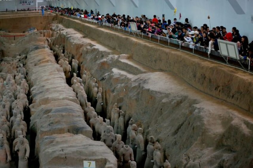 This photo taken in 2016 shows visitors taking photos of the Terracotta Army at the museum