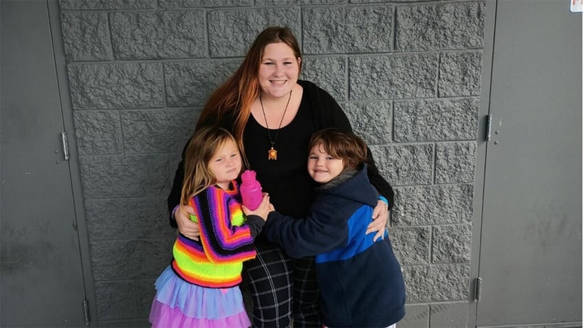 Rain Mancini with her children