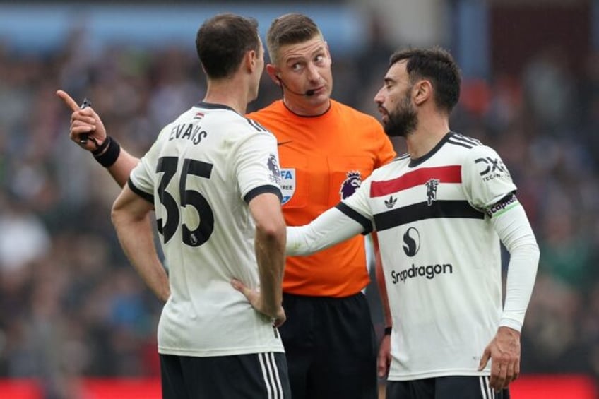 Defender Jonny Evans (left) helped Manchester United battle to a 0-0 draw against Aston Vi