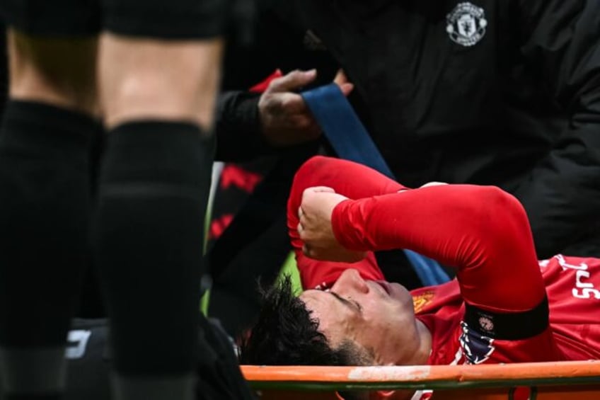 Manchester United's Lisandro Martinez left the field on a stretcher after suffering a knee