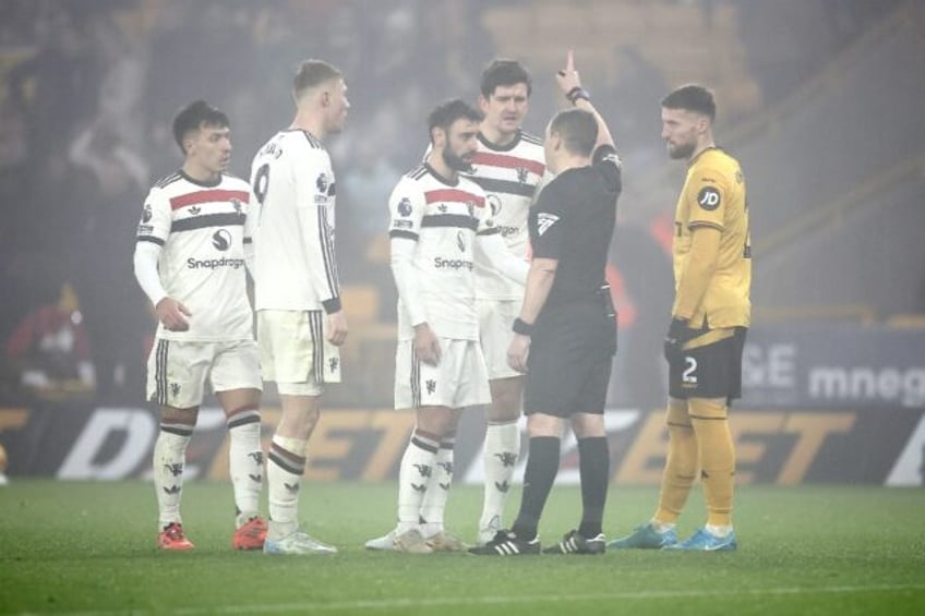 Bruno Fernandes (centre) was sent-off in Manchester United's 2-0 defeat at Wolves
