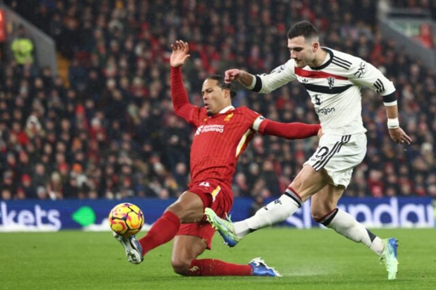 Manchester United defender Diogo Dalot (R) in action during Sunday's draw at Liverpool