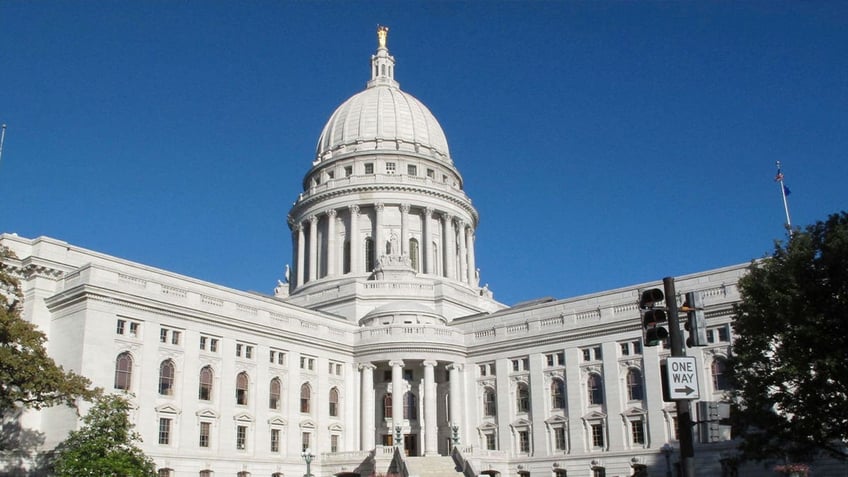 man who brought guns to wisconsin capitol twice faces misdemeanor charge