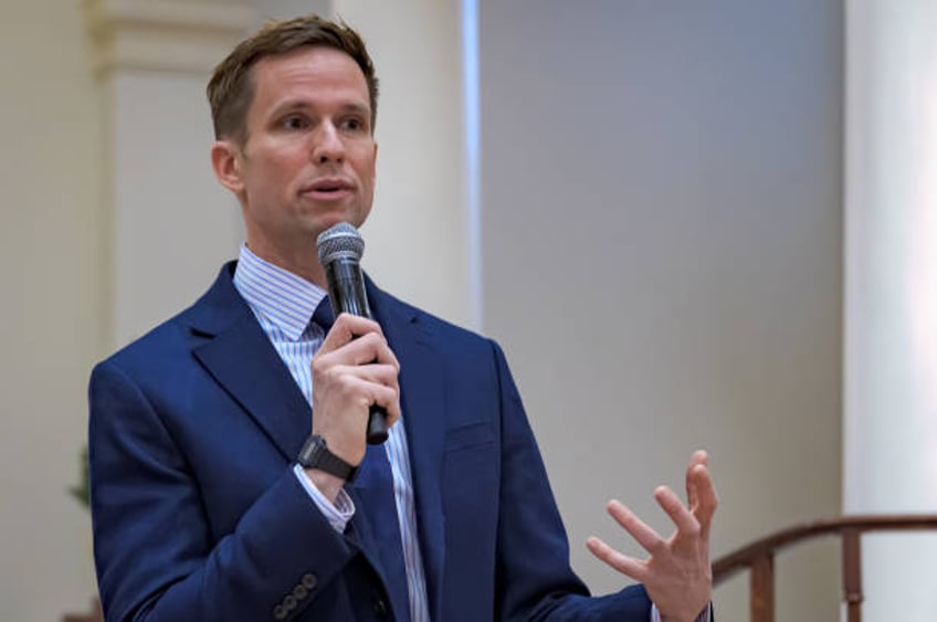 Councilmember Erik Bottcher seen speaking to Holy Apostles volunteers. Manhattan Borough President Mark Levine and NYC Councilmember Erik Bottcher...