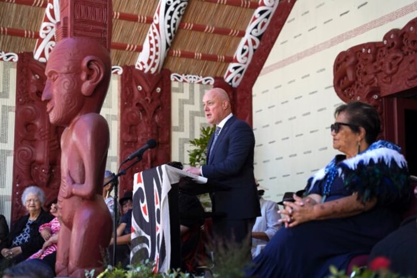 A handout photo from the Office of the Prime Minister shows New Zealand Prime Minister Christopher Luxon speaking at the Waitangi Treaty Grounds