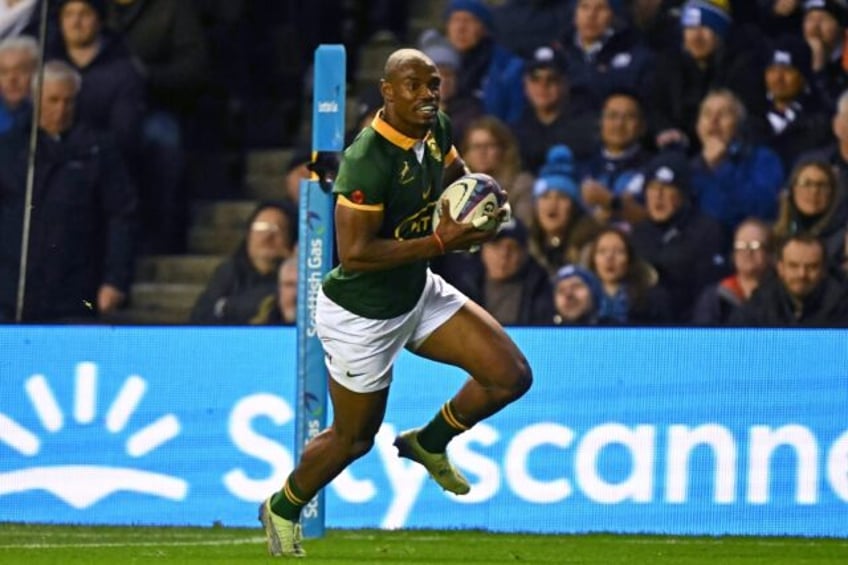 At the double: South Africa wing Makazole Mapimpi runs in his second try against Scotland