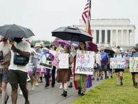 Marchers rally on the National Mall for WorldPride 2025
