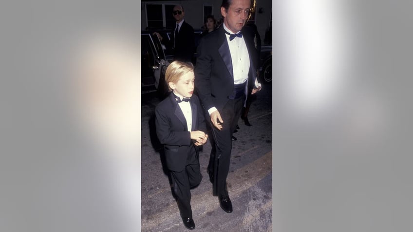 Macaulay Culkin and father Kit Culkin wearing tuxedos together