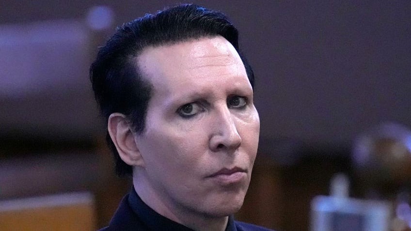 Musical artist Marilyn Manson, waits for the judge to arrive