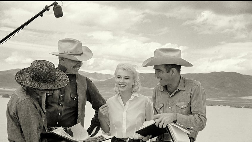 Marilyn Monroe smiling with the cast of The Misfits