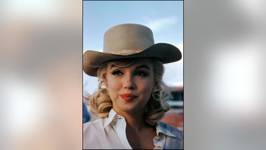 A close-up of Marilyn Monroe wearing a cowboy hat.