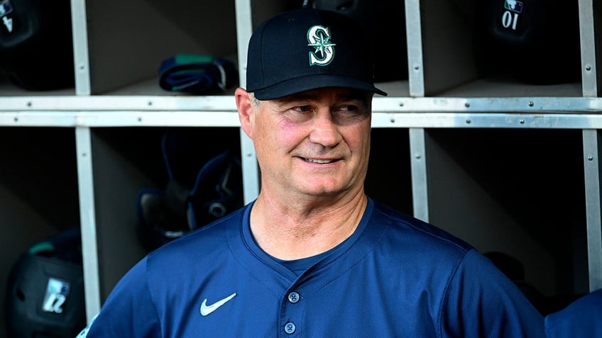 Scott Servais looks on field