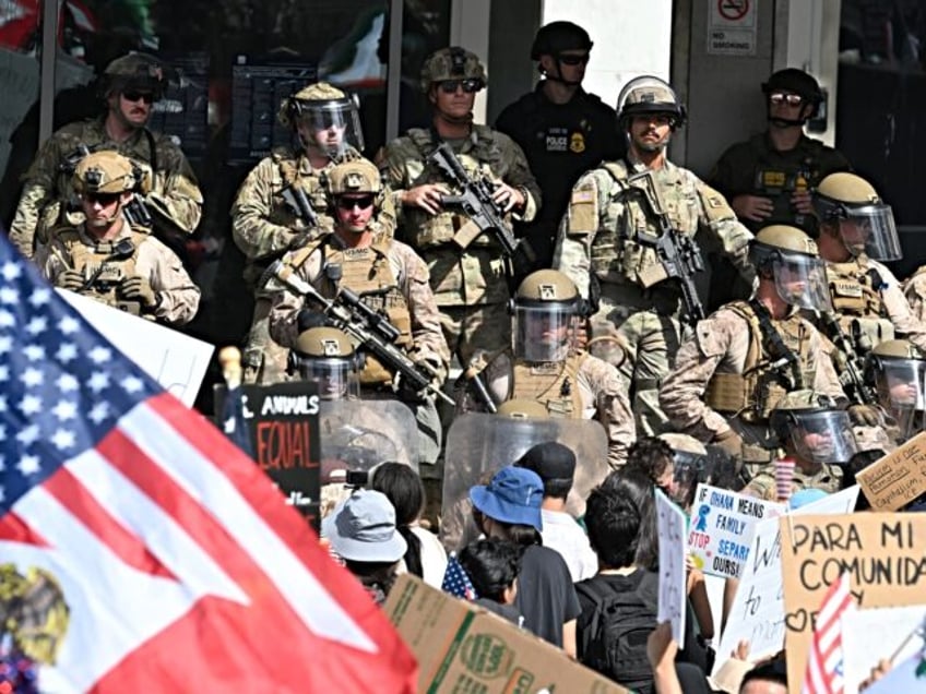 US Marines, California National Guard and police stand guard on the steps of the Federal B