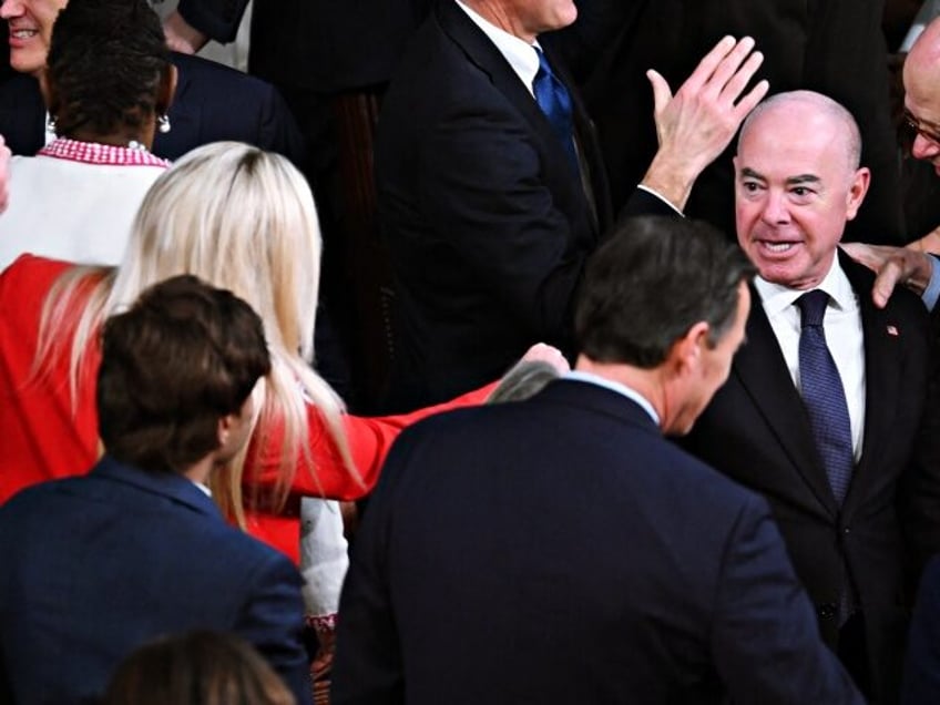 (L-R) US Representative Marjorie Taylor-Greene (R-GA) greets US Homeland Security Secretar