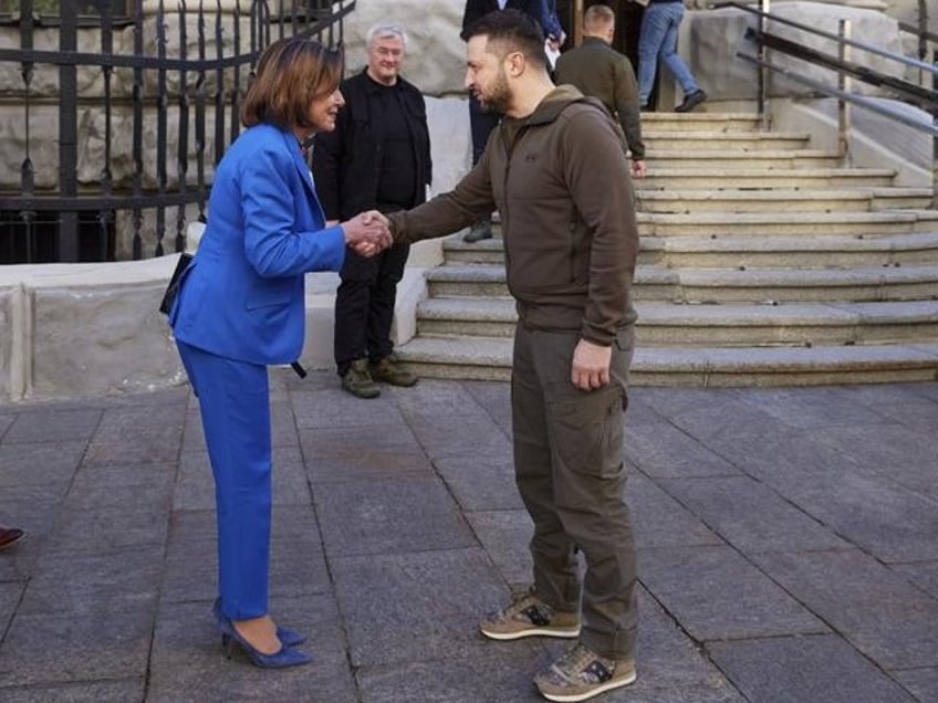 In this image released by the Ukrainian Presidential Press Office on Sunday, May 1, 2022, Ukrainian President Volodymyr Zelenskyy, centre right, and U.S. Speaker of the House Nancy Pelosi shake hands during their meeting in Kyiv, Ukraine, Saturday, April 30, 2022. Pelosi, second in line to the presidency after the vice president, is the highest-ranking American leader to visit Ukraine since the start of the war, and her visit marks a major show of continuing support for the country’s struggle against Russia. (Ukrainian Presidential Press Office via AP)